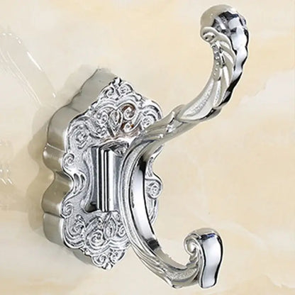 Chrome-plated metal wall hook with ornate scrollwork and curved loop for clothes in antique bronze wall hook style