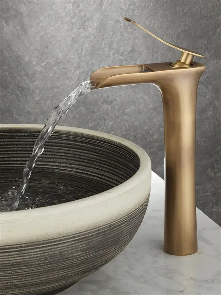 DecorBites antique bronze waterfall bathroom faucet with brass finish, sleek tall design, and curved spout for hot and cold mixer tap