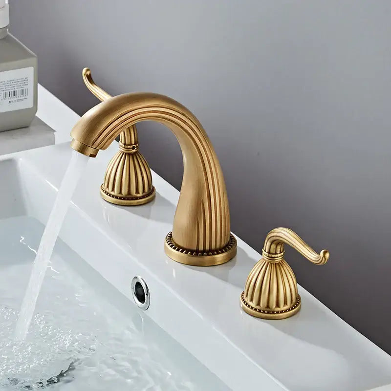 DecorBites antique bronze widespread basin faucet with three ornate brass handles and fluted spout in antique bronze finish