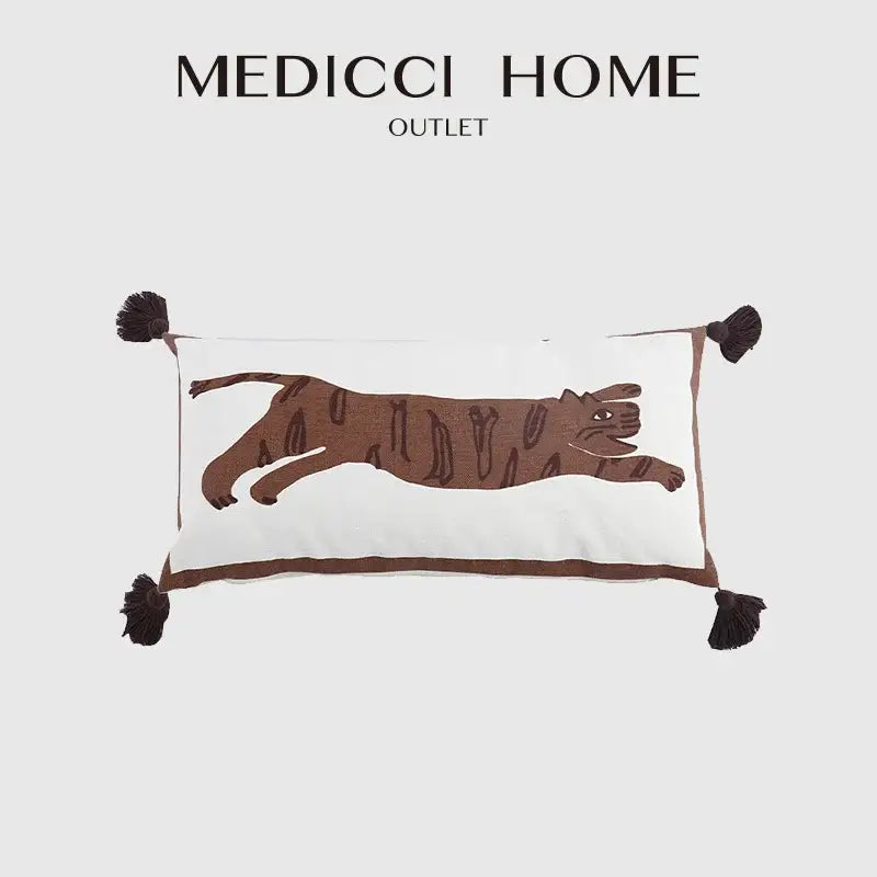 White rectangular pillow cover with antique brown tiger print embroidery and dark brown tassels by medicci home outlet
