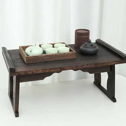 Dark wood solid wood foldable table with carved legs and scalloped edge for hanfu shoots and tea cooking