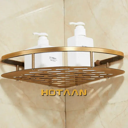 Gold-toned metal corner shower caddy with perforated design and vertical bars in antique finish aluminum shower style