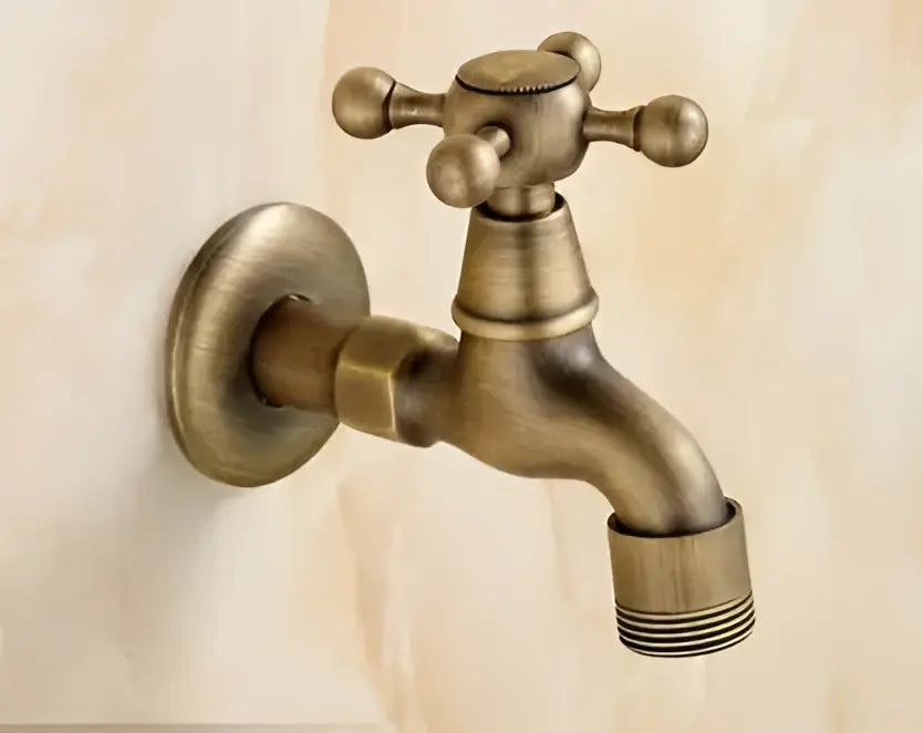 Antique brass garden bibcocks tap with cross-handle and threaded spout for outdoor washing and bathroom use