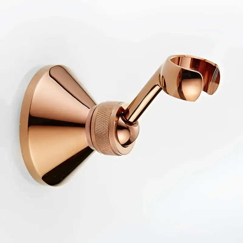 Rose gold metallic wall-mounted towel rack with textured joint complementing decorbites antique gold handheld shower head