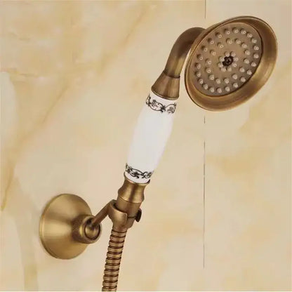 Decorbites antique brass-finished shower head with white ceramic handle and black floral patterns shower head holder