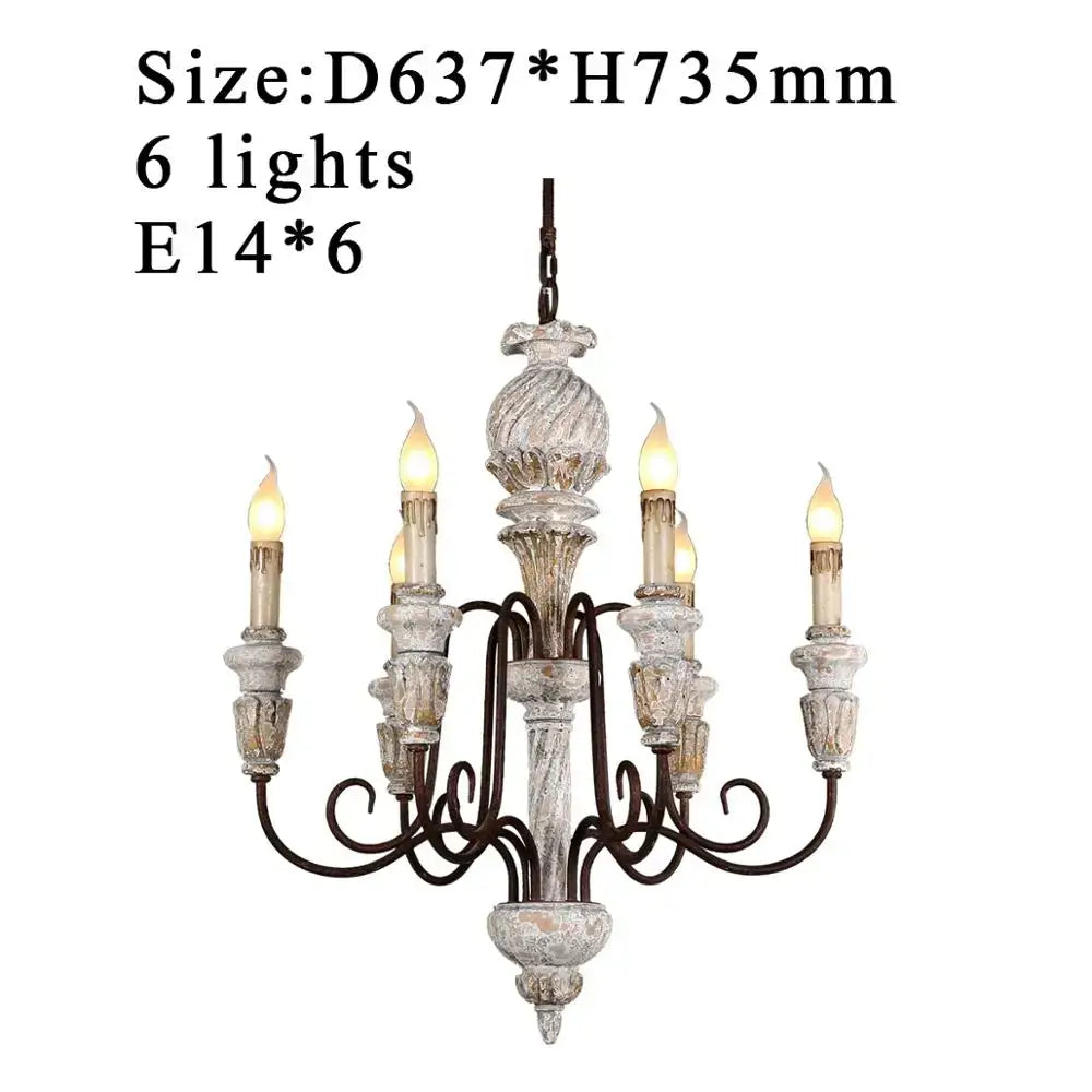Decorbites antique white wooden chandelier with six candle-style lights and dark metal scrollwork in french rustic style