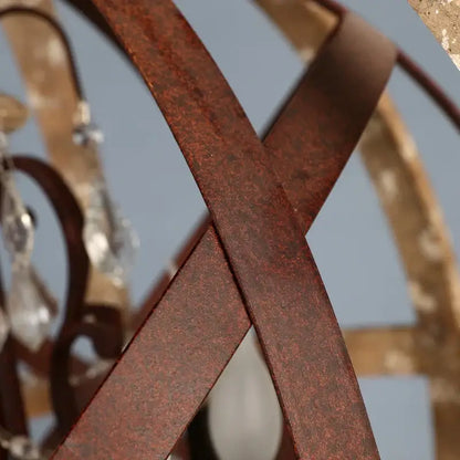 Rusty brown metal bands form an intricate pattern on decorbites antique wood globe chandelier for versatile room use