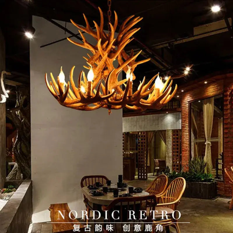 Decorbites antler pendant chandelier with warm golden brown finish and intricate branching industrial style design