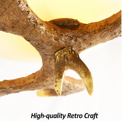 Natural brown antler with polished golden-tipped tine in decorbites antler resin glass ceiling light for home decor
