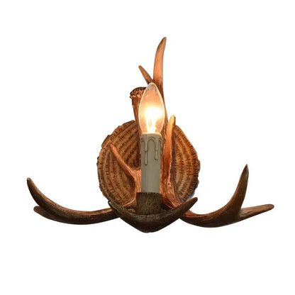 Decorbites antler resin wall lamp with warm candle bulb nestled in rustic brown copper-toned antlers for living room decor