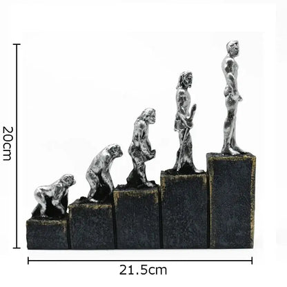 Silver metallic DecorBites ape man evolution sculpture resin artwork on black bases depicting man evolution stages