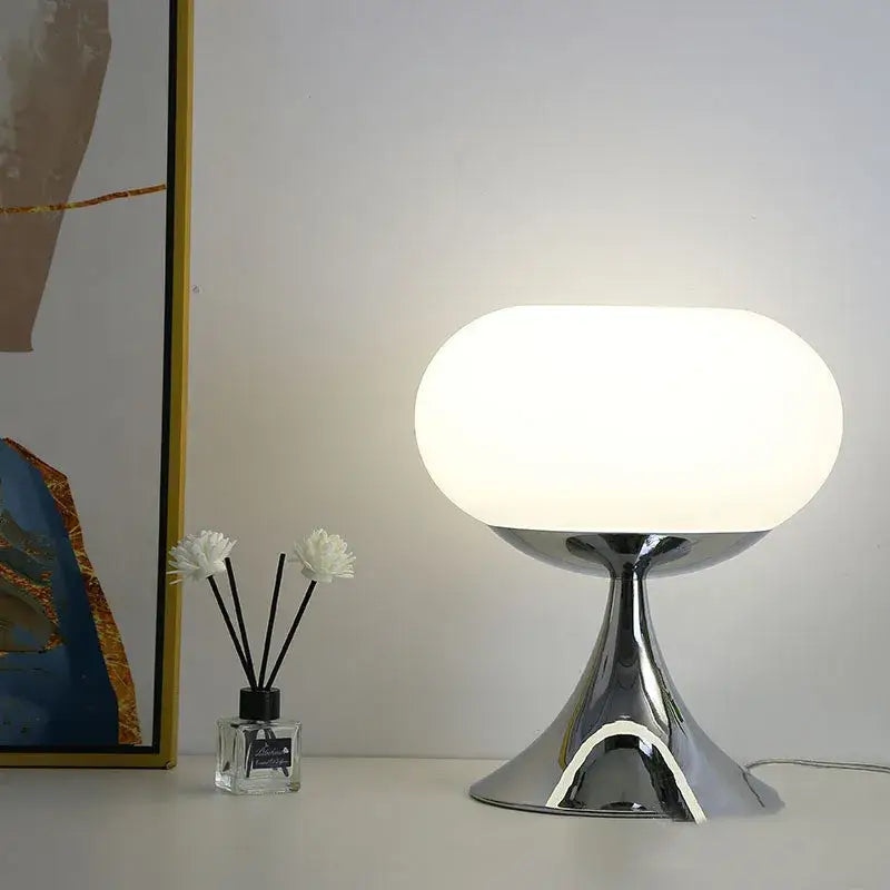 Modern chrome finished table lamp with a smooth white glass shade from decorbites apple green table lamp collection