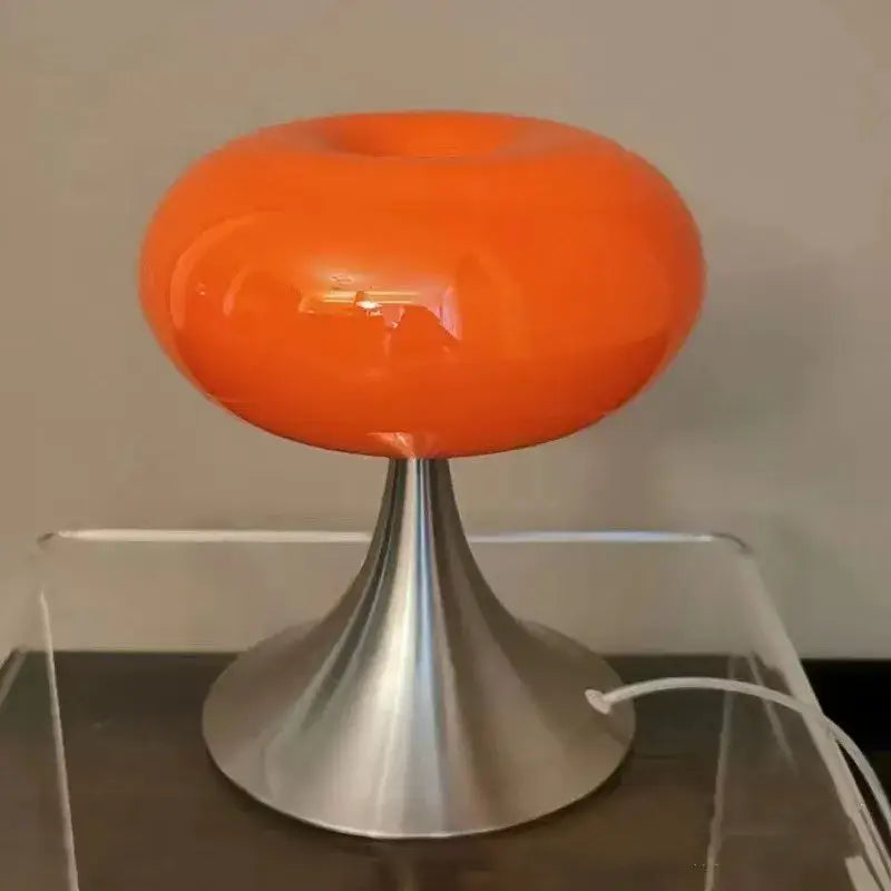Vibrant orange translucent glass table lamp with sleek metallic base from decorbites apple green table lighting collection