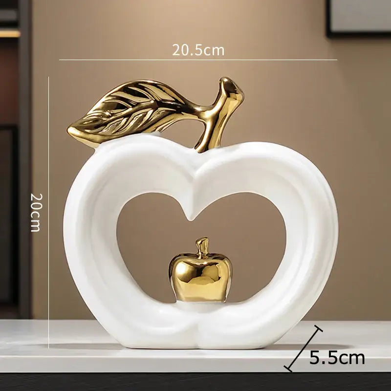 Decorbites apple sculpture white ceramic with gold leaf and heart cutout holding miniature golden apple for decor