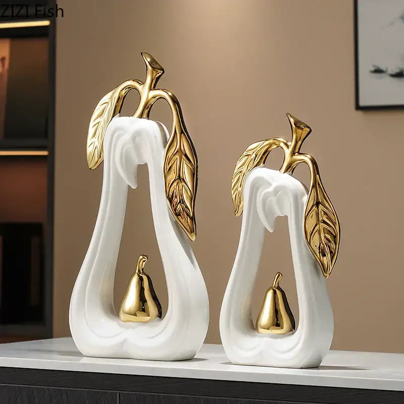White ceramic decorbites apple sculpture with gold leaf and metallic accents for minimalist desk decor