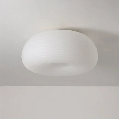 A sleek white frosted glass decorbites apple shape ceiling chandelier with a smooth rounded dome design for bedroom and kitchen