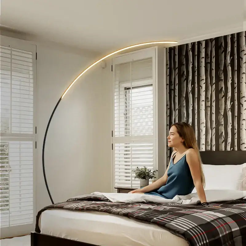 DecorBites arc floor lamp with curved black metal frame and warm LED strip for indoor dining and living room decor