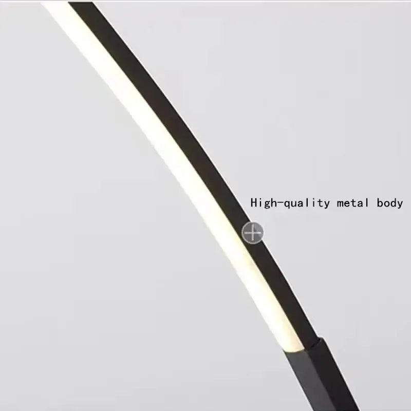 Black led desk lamp with sleek metal body and illuminated white light strip from decorbites arc led floor lamp series