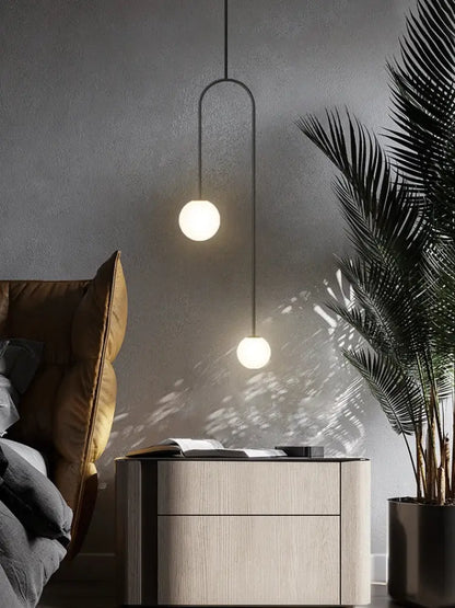 Modern black metal pendant light with two white glass bulbs from decorbites arc line chandelier for living and dining room