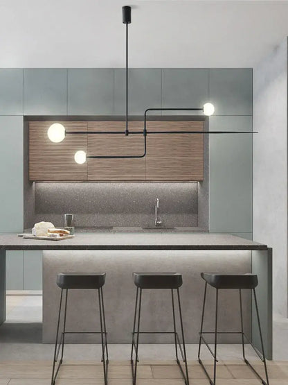 Modern black metal pendant light with three spherical white bulbs in decorbites arc line chandelier for living spaces