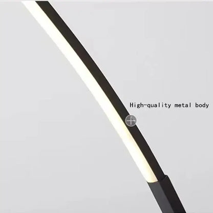 A sleek DecorBites arc shape floor lamp with black metal body and illuminated white LED strip for modern decor