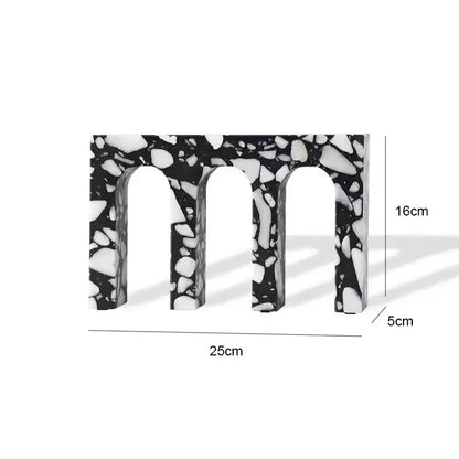 Black and white terrazzo sculpture featuring a decorbites archway terrazzo with three arched openings for home decor