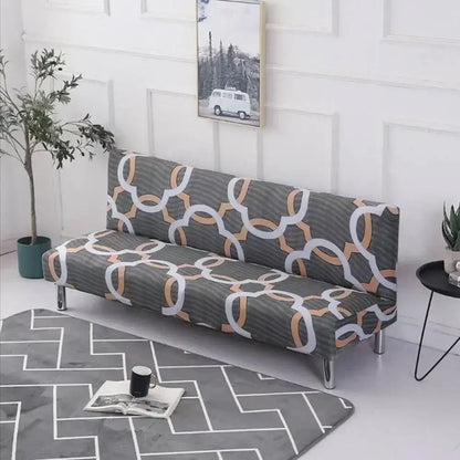 Gray decorbites armless futon sofa cover with elastic slipcover and geometric white copper ring pattern on textured fabric