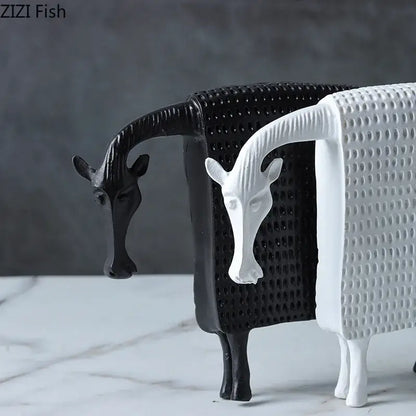 Black and white resin goat figurines with textured dotted bodies as decorbites armored warhorse desk decoration