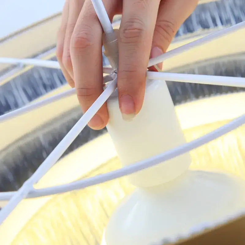 White plastic fan blade assembly with central hub and radial spokes for decorbites art deco tiered chandelier in black gold finishing