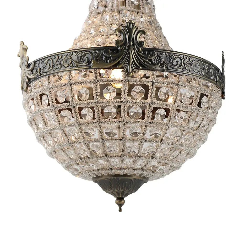 An ornate decorbites art deco crystal led chandelier with dark bronze metal frame and floral detailing for parlor and lobby
