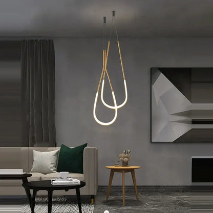 Modern gold-toned decorbites art deco pendant light with sleek vertical led tubes and minimalist metallic rods for dining room