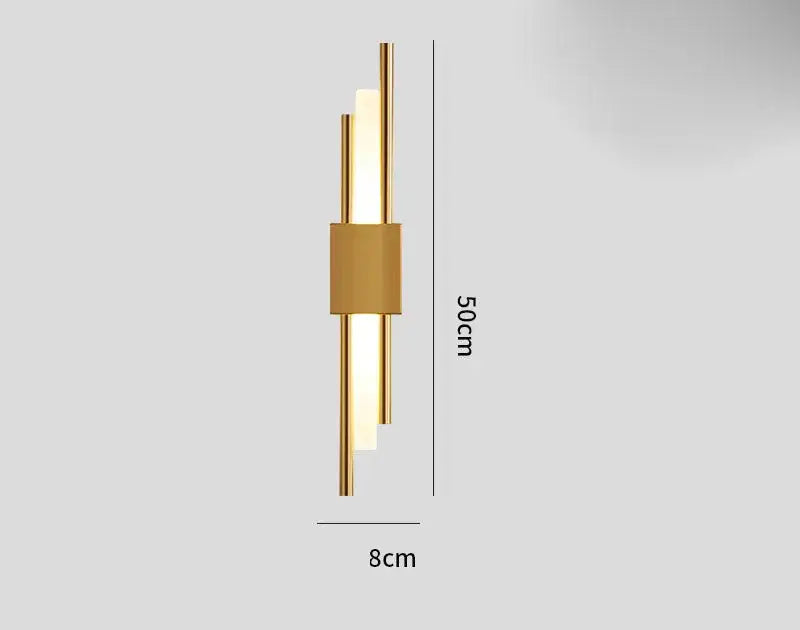 Modern gold-toned DecorBites Art Deco wall sconce with three vertical LED tubes and marble accent for bedroom lighting