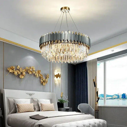 Decorbites art deco golden crystal chandelier with metallic gray and gold panels and cascading clear prisms