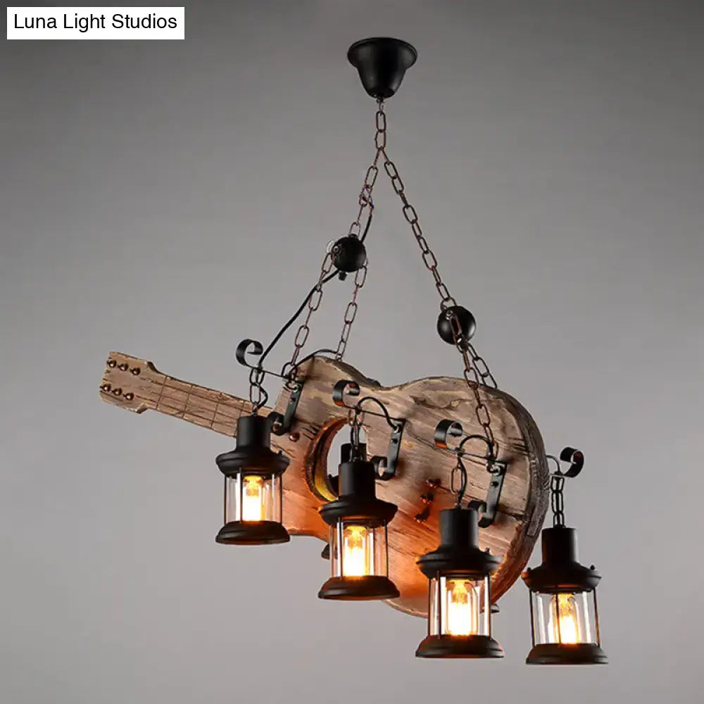 Rustic wooden guitar pendant light with four black lantern-style lights in light wood and black metal finish by decorbites