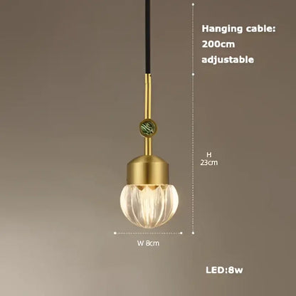 Gold-toned decorbites art deco pendant light with textured faceted glass globe and adjustable black cable vintage style