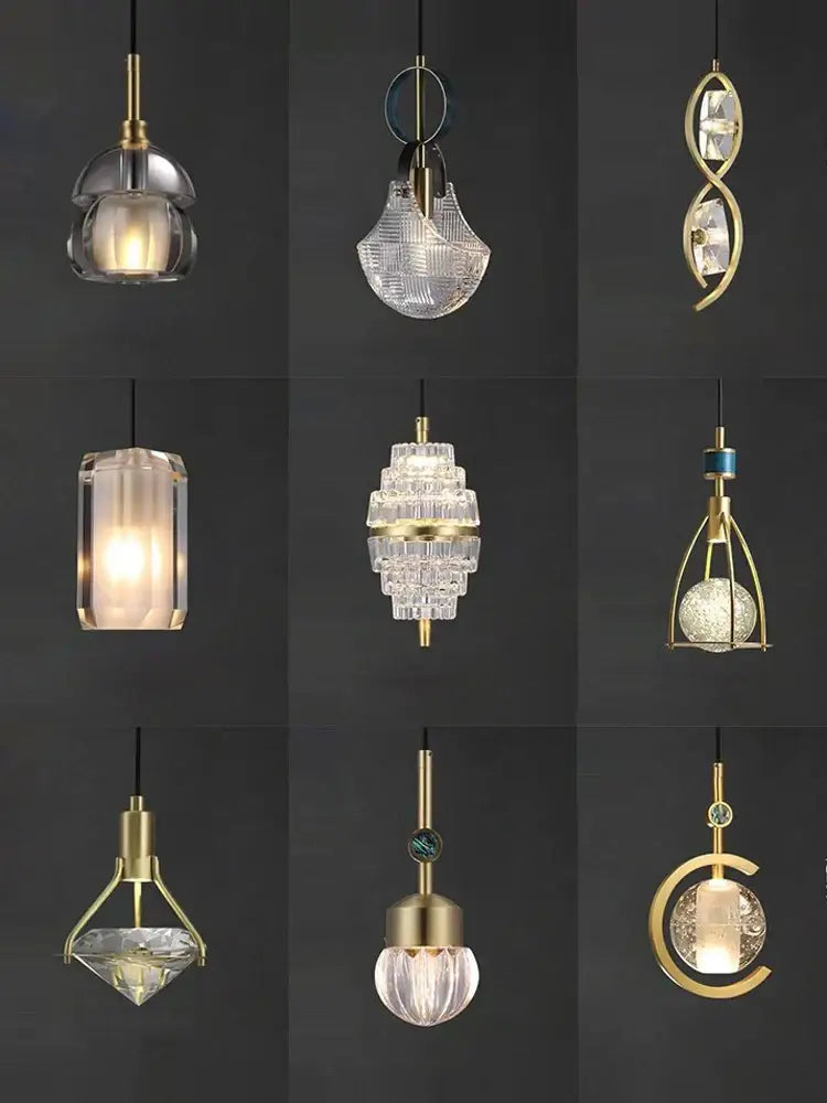 A collection of brass-finished decorbites art deco pendant lights with unique crystal and glass shades in vintage style