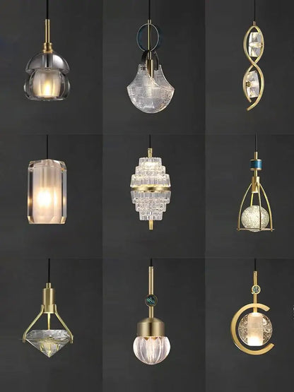A collection of brass-finished decorbites art deco pendant lights with unique crystal and glass shades in vintage style