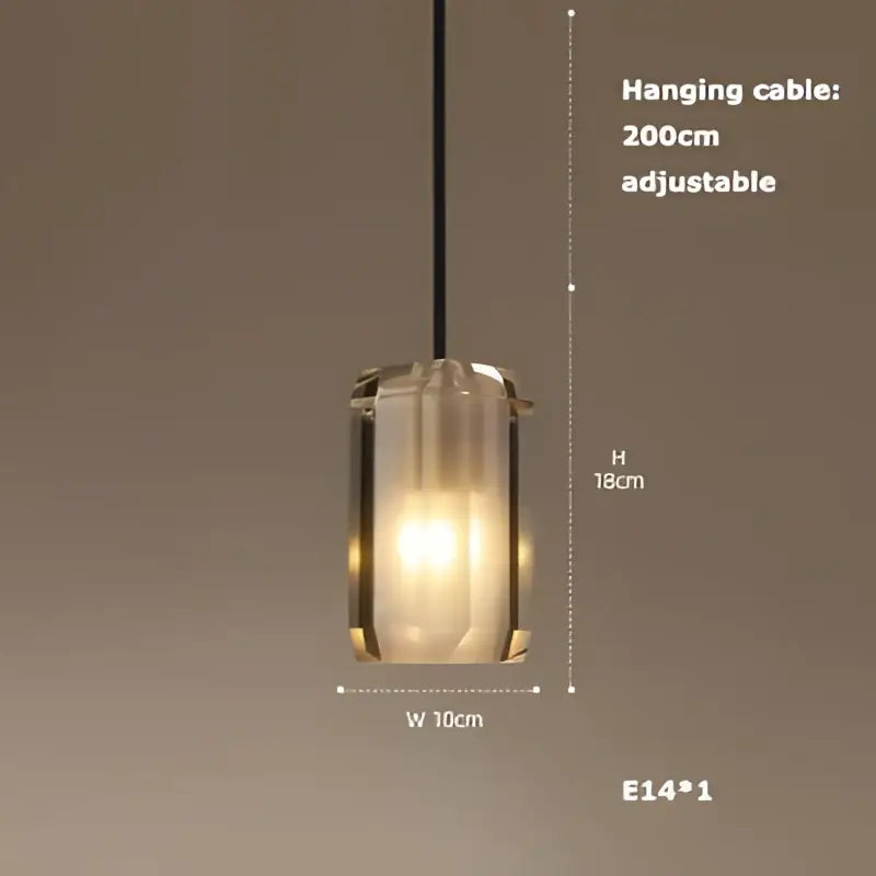 A modern cylindrical pendant light with frosted glass shade and black cable from decorbites art deco led chandelier collection