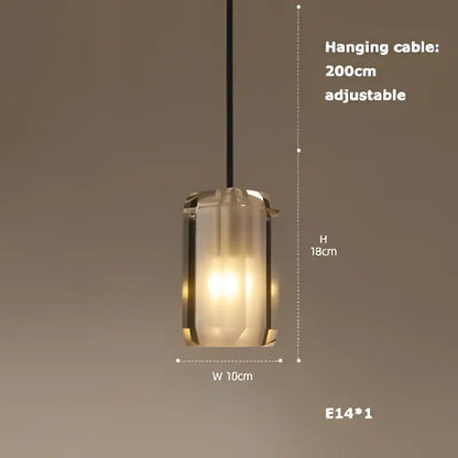 A modern cylindrical pendant light with frosted glass shade and black cable from decorbites art deco led chandelier collection