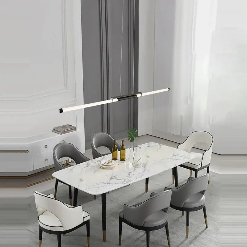 Modern marble dining table with sleek black legs paired with decorbites art deco led gold chandelier for dining room