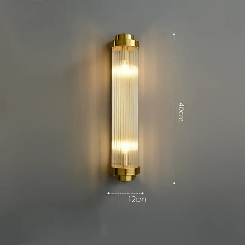 Gold-toned decorbites art deco wall sconce with vertical ribbed glass panels and sleek modern design for bedroom corridor lighting