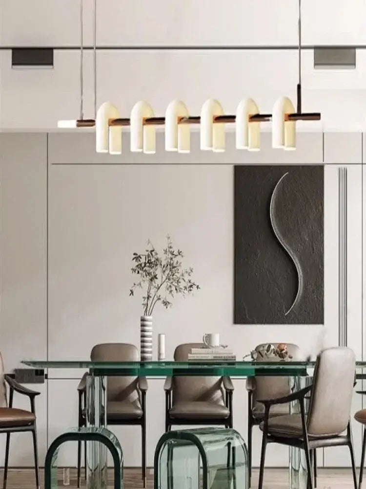 Modern minimalist pendant light with black metal frame and six warm curved glass shades for decorbites art deco white acrylic chandelier