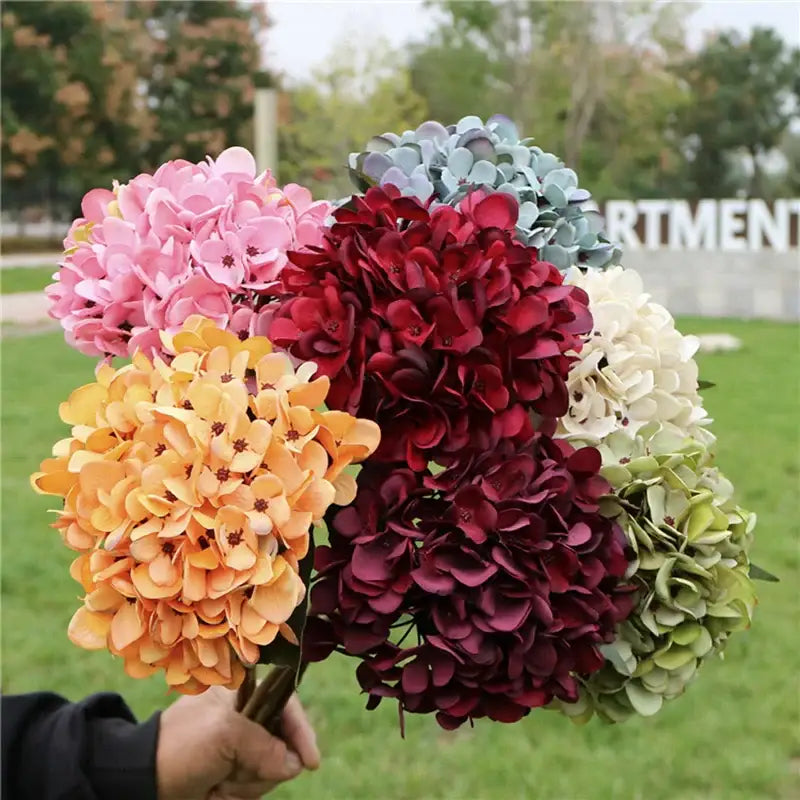 A vibrant bouquet of decorbites™ artificial hydrangea wedding flowers in assorted colors for indoor decoration