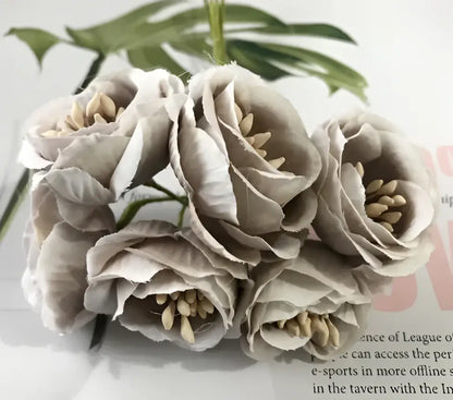 A cluster of decorbites artificial peony gray fabric flowers with layered petals and beige stamens for home garden wedding
