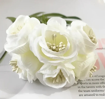 A cluster of decorbites artificial peony tea white silk flowers with layered petals and soft yellowish centers for home decor