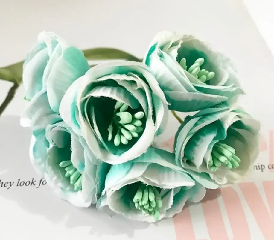A delicate decorbites artificial peony bouquet featuring mint green and white paper roses with layered soft petals