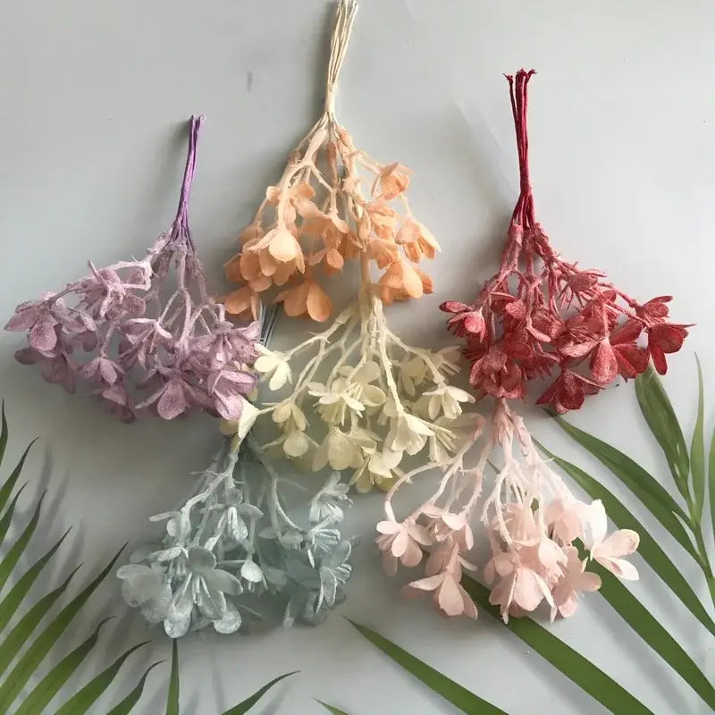 A collection of delicate dried hydrangea flower clusters in pastel shades featured with decorbites artificial plants