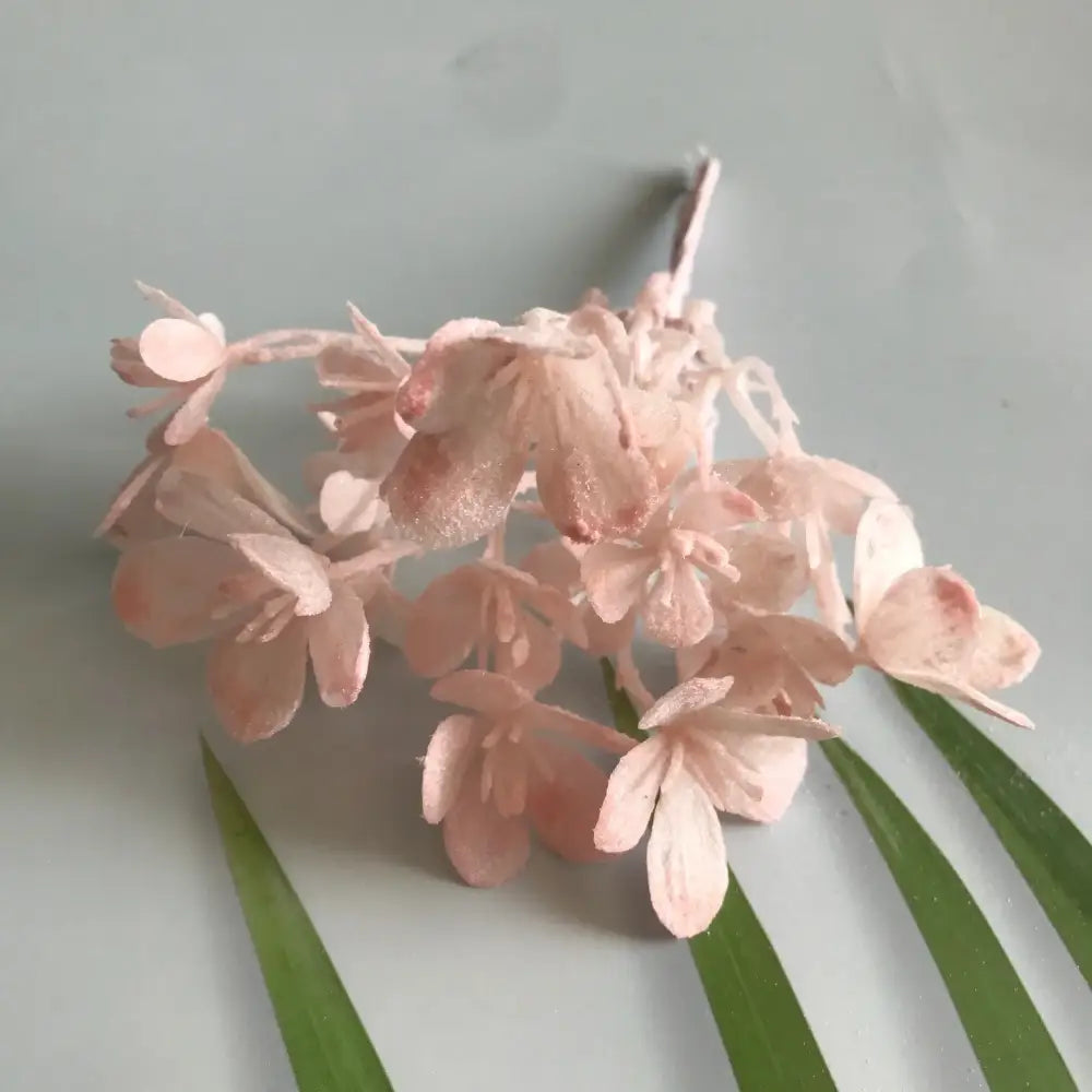 A delicate cluster of pale pink artificial plants with glittery hydrangea blossoms for decorbites artificial plants decor