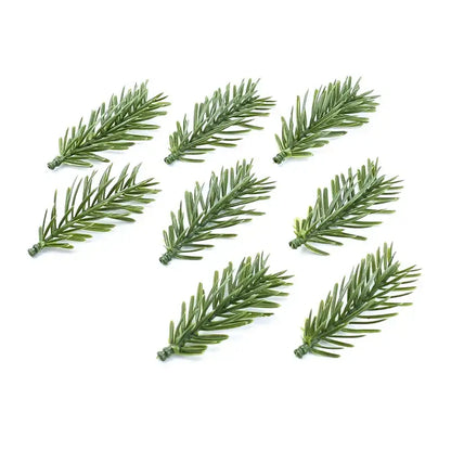 Green artificial plants pine branches by decorbites made of plastic with realistic needle texture for home decor use
