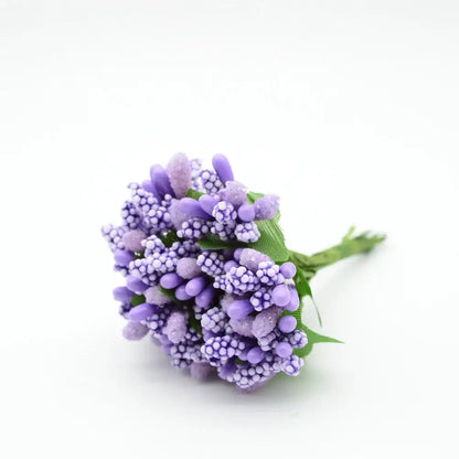 A delicate cluster of decorbites artificial stamen flowers with textured purple bead-like petals for home wedding decor